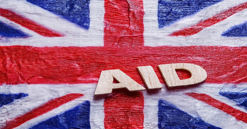 image of the Union Jack flag with the word aid across it